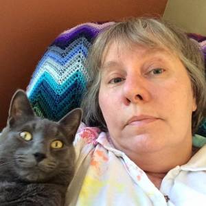 My familiar-in-training, Merlin, keeps me company.